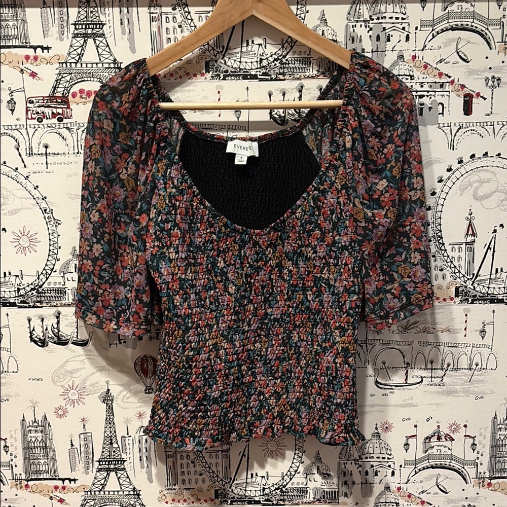 Evereve - Black Floral Smocked top. Mesh sleeves and scoop neck.